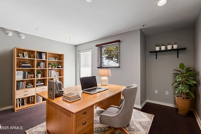 a view of a workspace with furniture