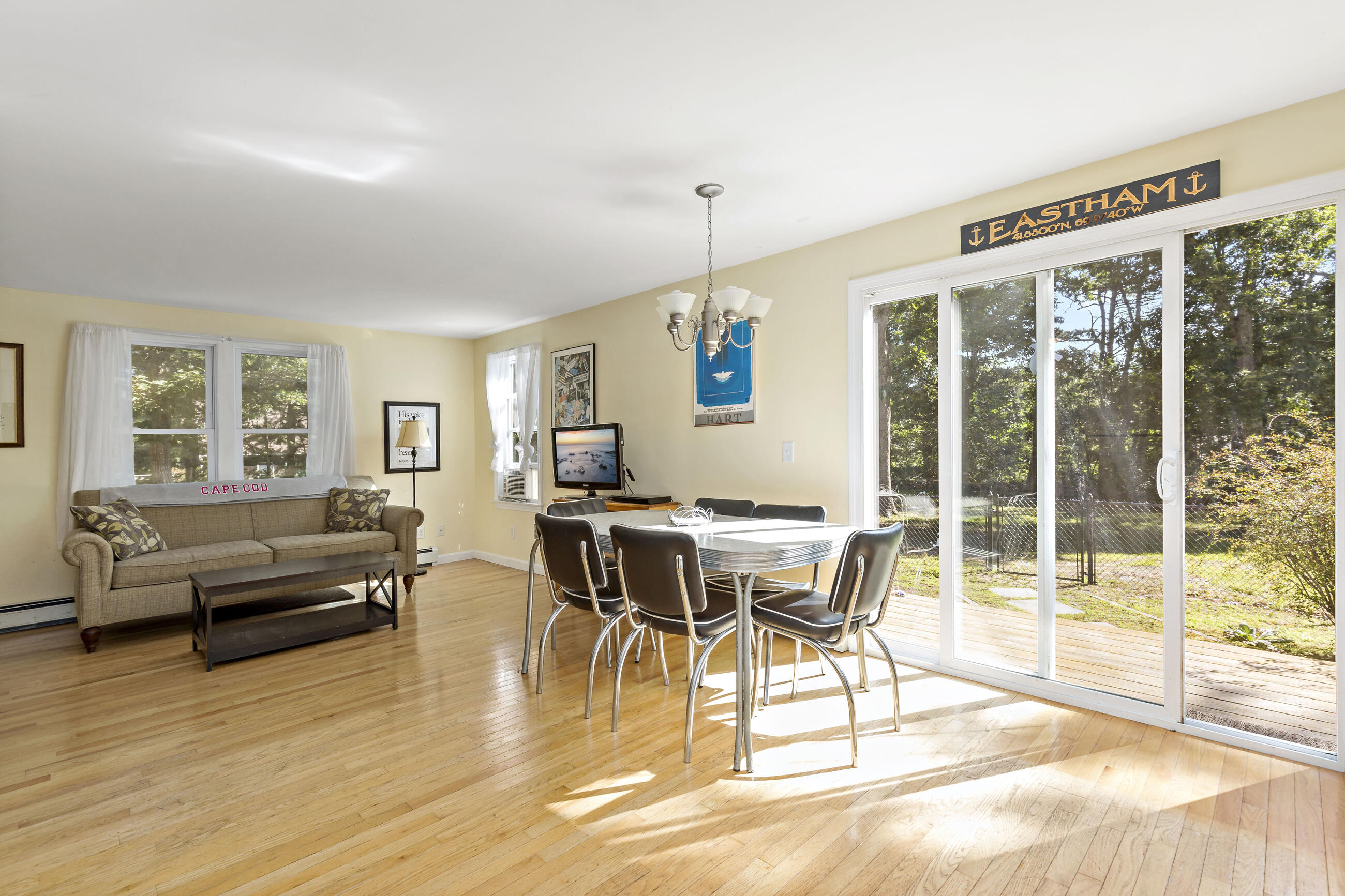 35 Whitney Road Eastham, MA 02642 - Photo 11 of 31 a view of a dining room with furniture window and wooden floor