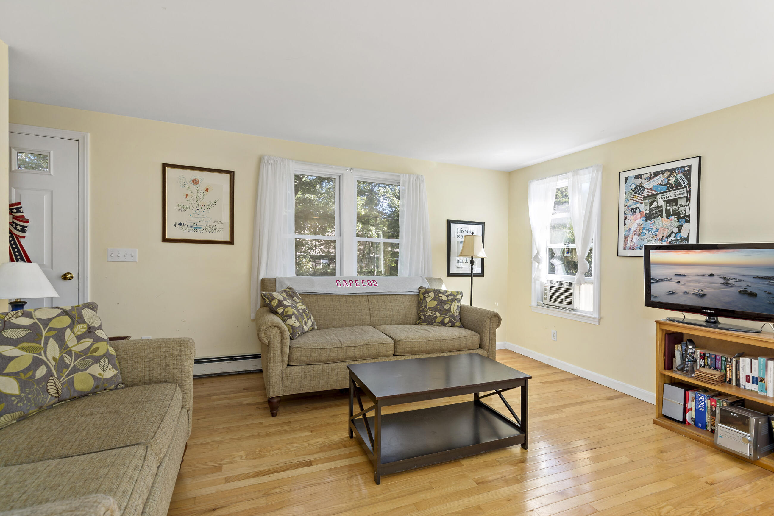 35 Whitney Road Eastham, MA 02642 - Photo 12 of 31 a living room with furniture and a book shelf
