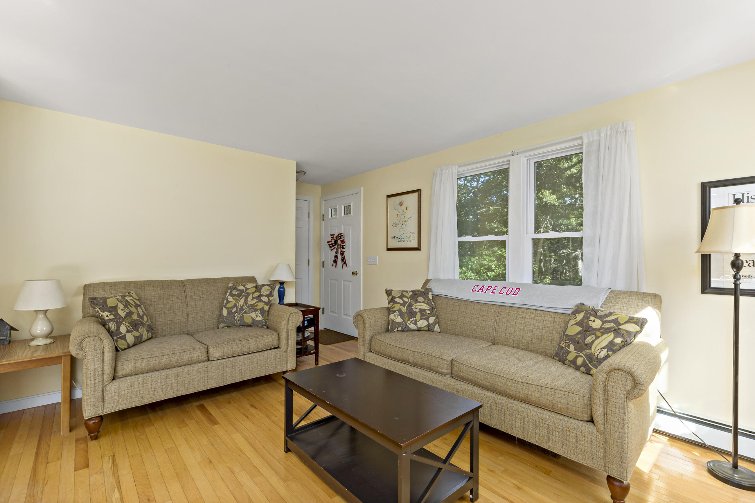 35 Whitney Road Eastham, MA 02642 - Photo 13 of 31 a living room with furniture and windows