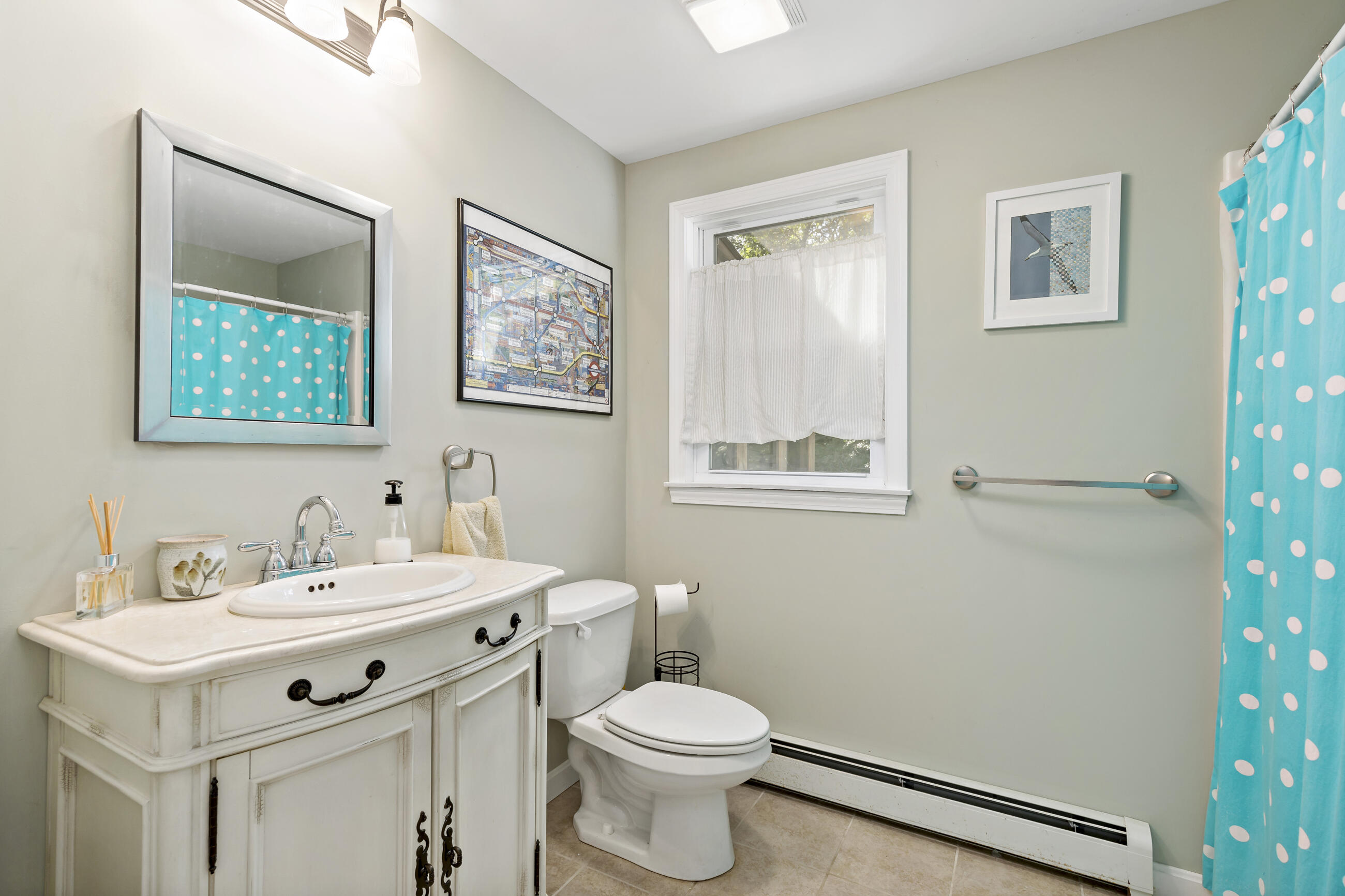 35 Whitney Road Eastham, MA 02642 - Photo 18 of 31 a bathroom with a sink mirror vanity and toilet