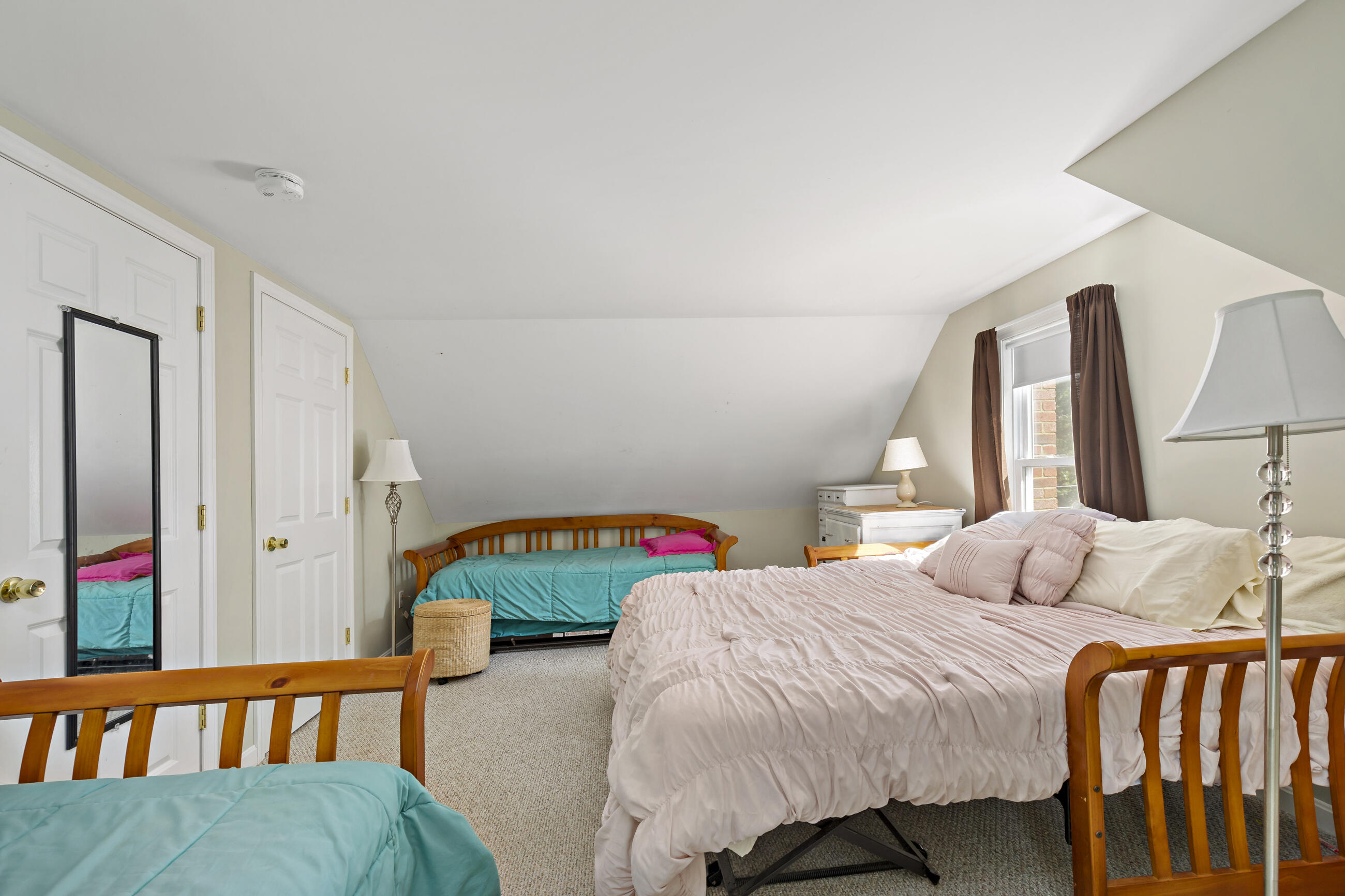 35 Whitney Road Eastham, MA 02642 - Photo 21 of 31 a bedroom with two beds and a dresser