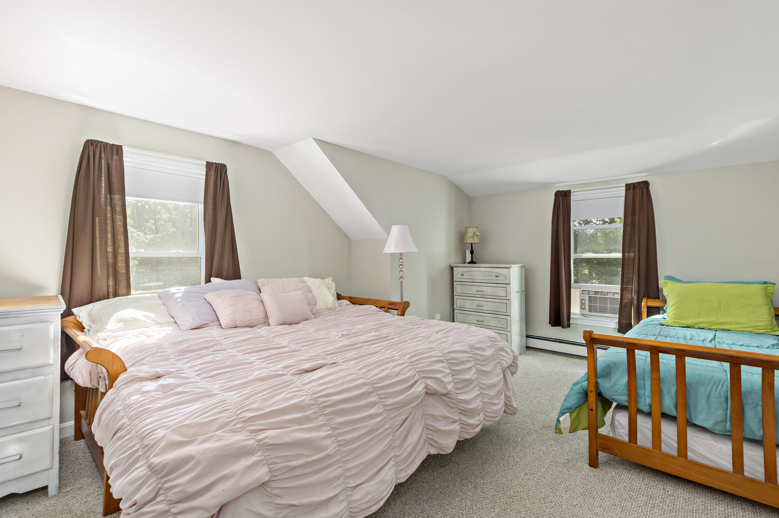 35 Whitney Road Eastham, MA 02642 - Photo 22 of 31 a bedroom with a bed and a large window