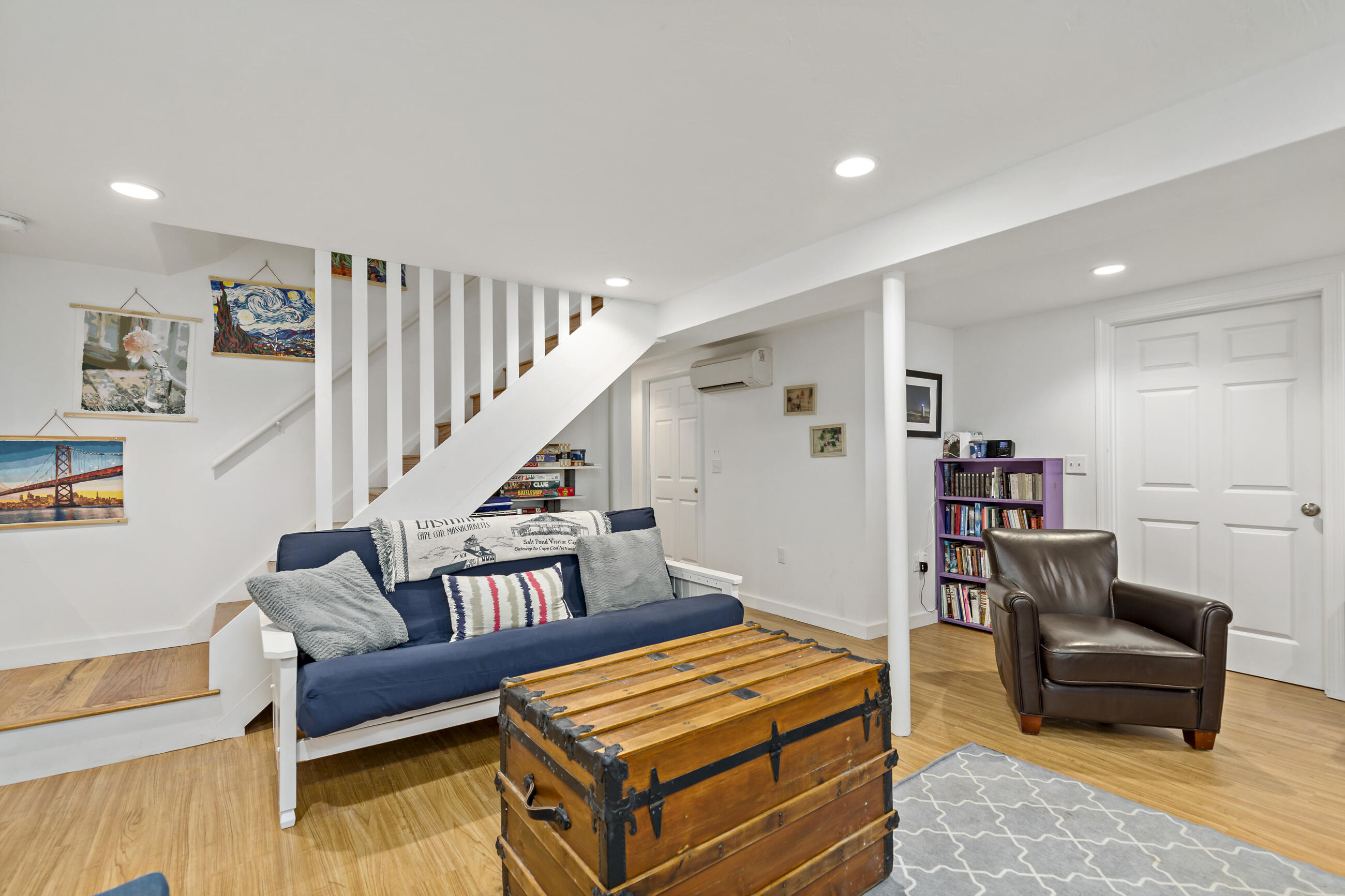 35 Whitney Road Eastham, MA 02642 - Photo 24 of 31 a living room with furniture and a wooden floor