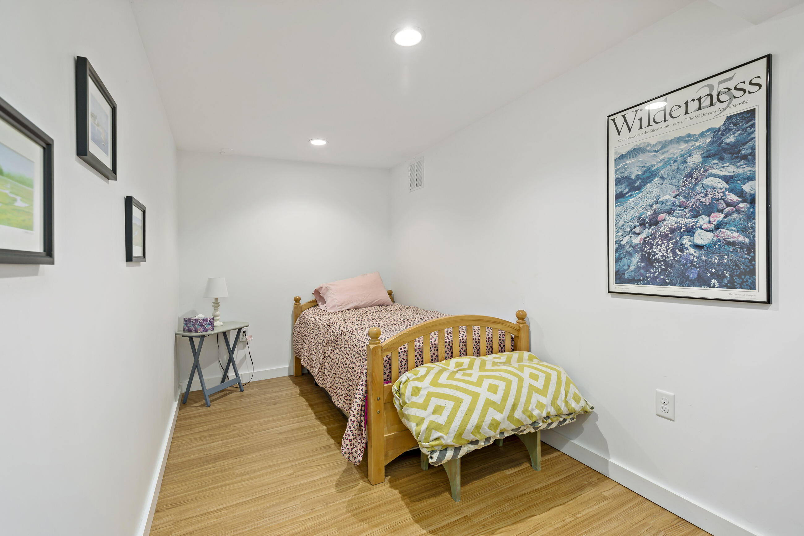 35 Whitney Road Eastham, MA 02642 - Photo 26 of 31 a bedroom with a bed and wooden floor