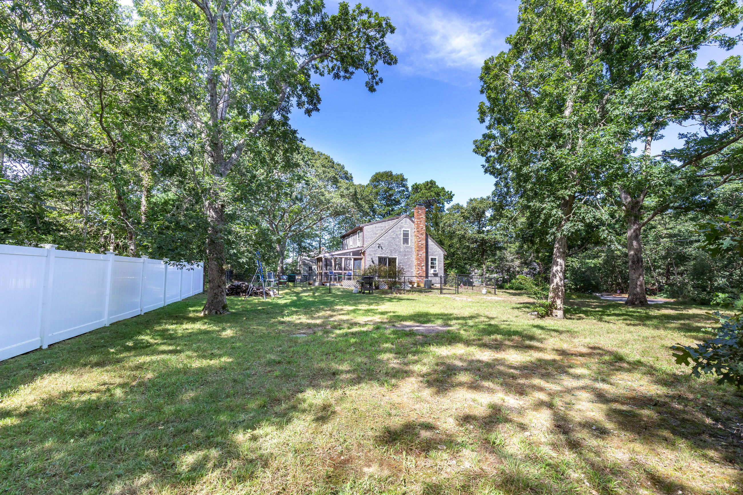 35 Whitney Road Eastham, MA 02642 - Photo 5 of 31 a backyard of a house