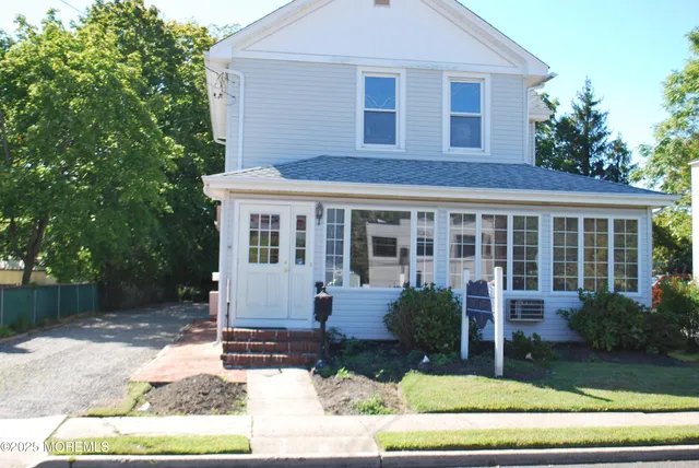 a view of a house with a yard and plants
