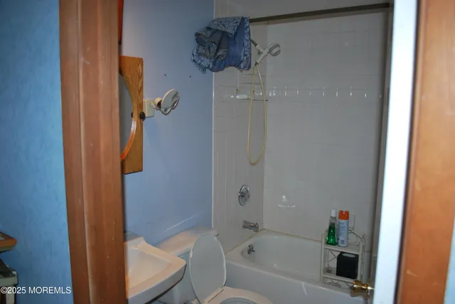 a picture of a bathroom with a sink