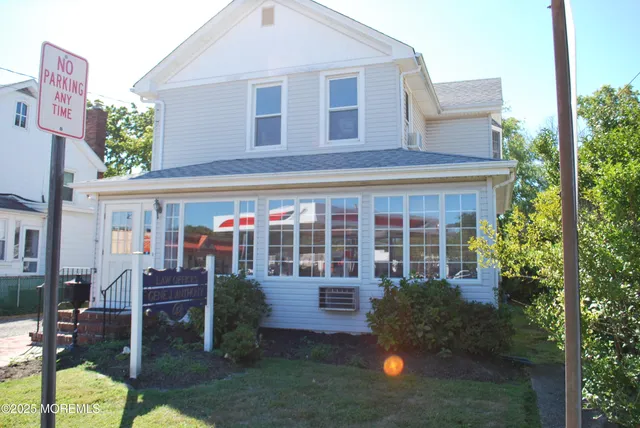 a front view of a house with a yard and porch
