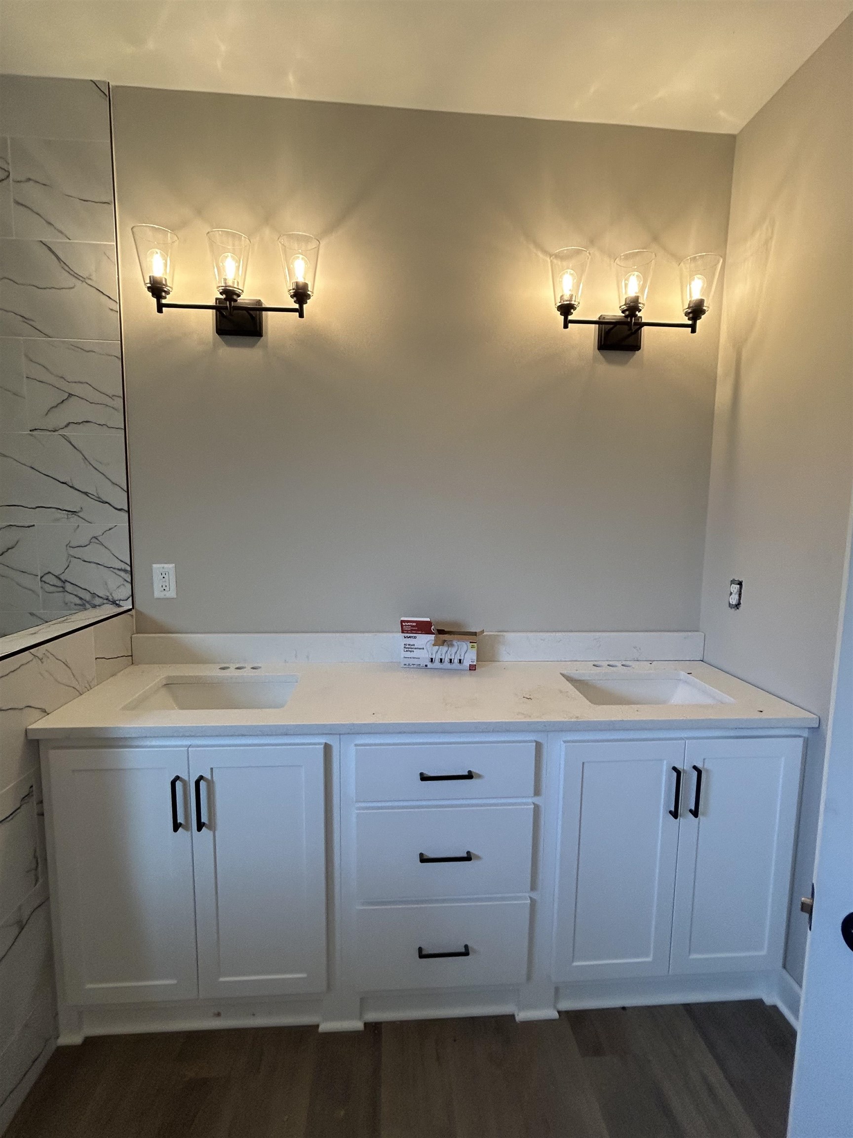 1805 Wortham Road Atoka, TN 38004 - Photo 16 of 20 Bathroom featuring a sink, double vanity, and wood finished floors
