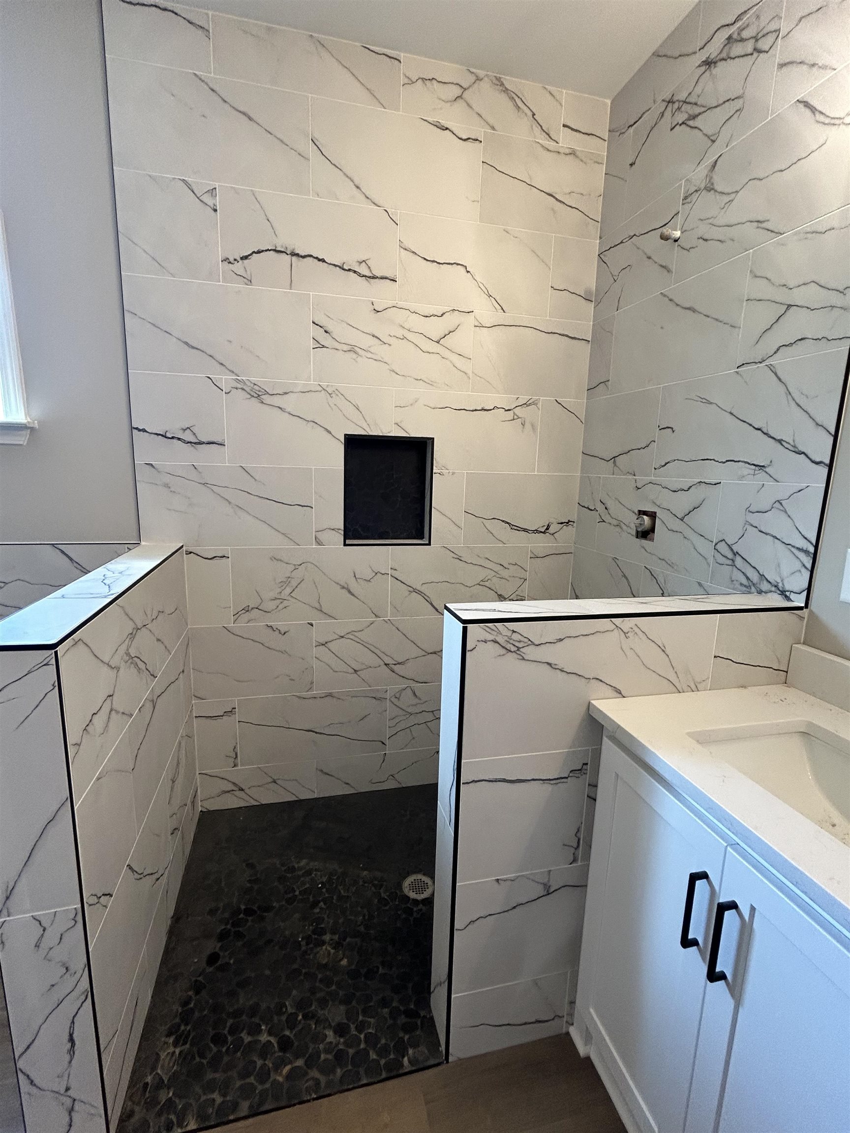 1805 Wortham Road Atoka, TN 38004 - Photo 17 of 20 Full bathroom with tile walls, tiled shower, and vanity