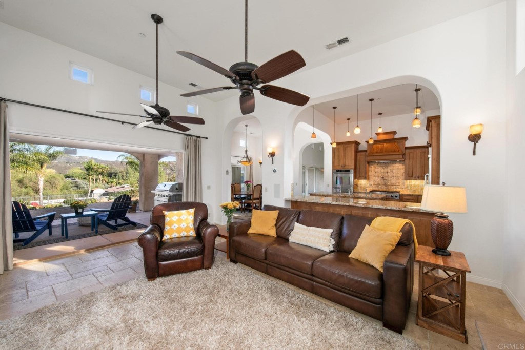 15460 Markar Road Poway, CA 92064 - Photo 16 of 36 a view of a livingroom with furniture and a floor to ceiling window