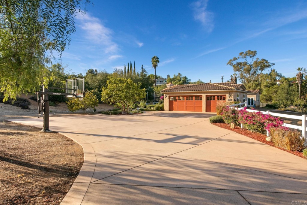 15460 Markar Road Poway, CA 92064 - Photo 5 of 36 a front view of a house with a yard