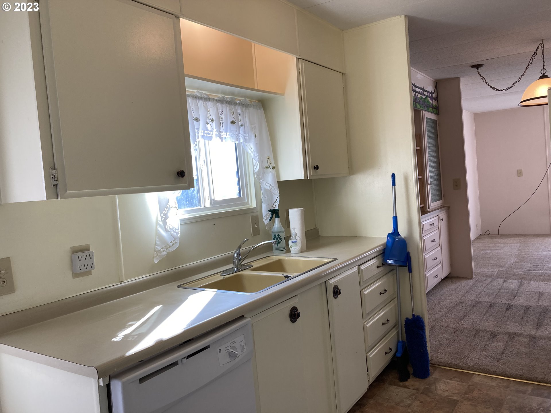 205 South 54th Street, Unit 7 Springfield, OR 97478 - Photo 14 of 32 a kitchen with a sink cabinets and window