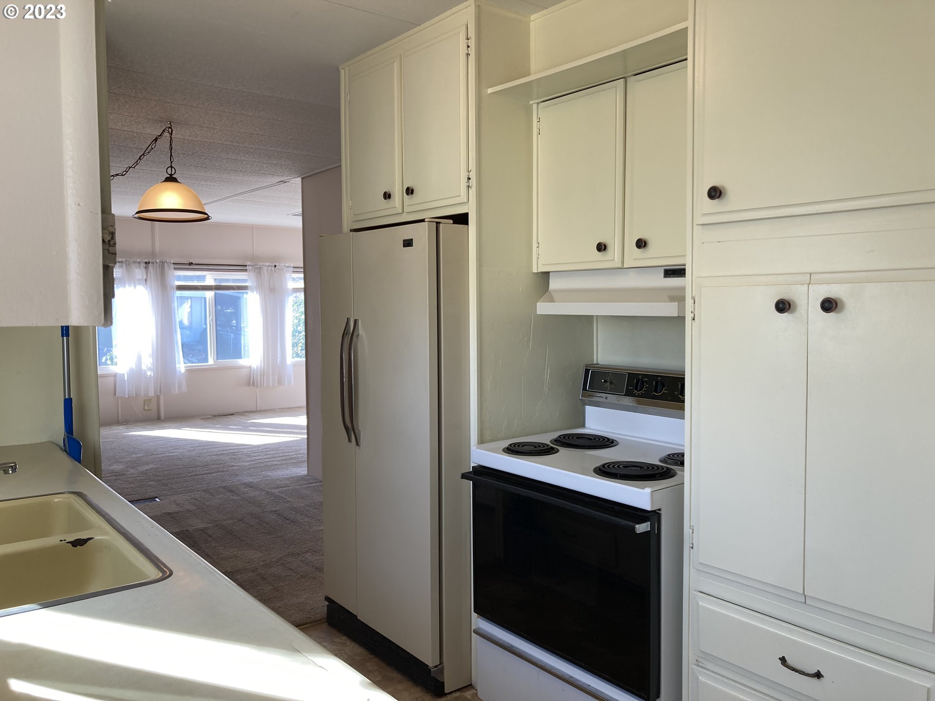 205 South 54th Street, Unit 7 Springfield, OR 97478 - Photo 15 of 32 a kitchen with stainless steel appliances granite countertop a refrigerator and a stove