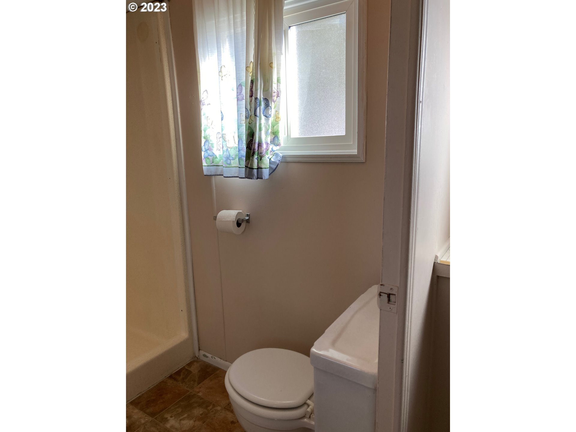 205 South 54th Street, Unit 7 Springfield, OR 97478 - Photo 20 of 32 a white toilet sitting next to a bathroom sink