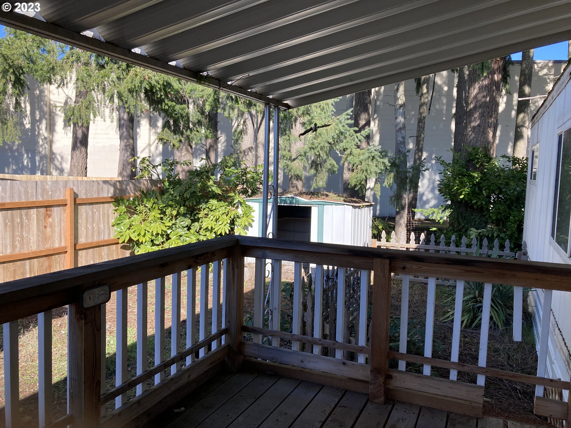 205 South 54th Street, Unit 7 Springfield, OR 97478 - Photo 29 of 32 a balcony with wooden floor in outdoor space