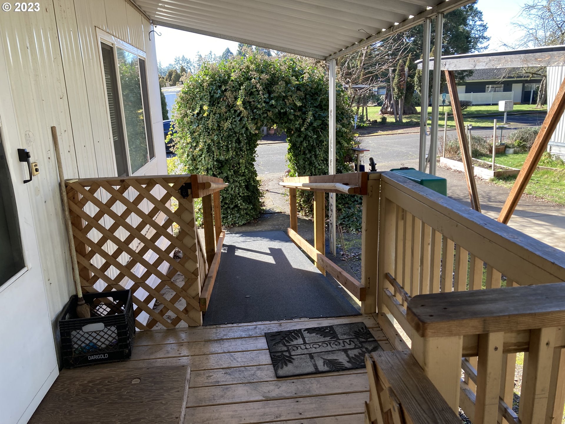 205 South 54th Street, Unit 7 Springfield, OR 97478 - Photo 4 of 32 a view of balcony with wooden floor and outdoor seating