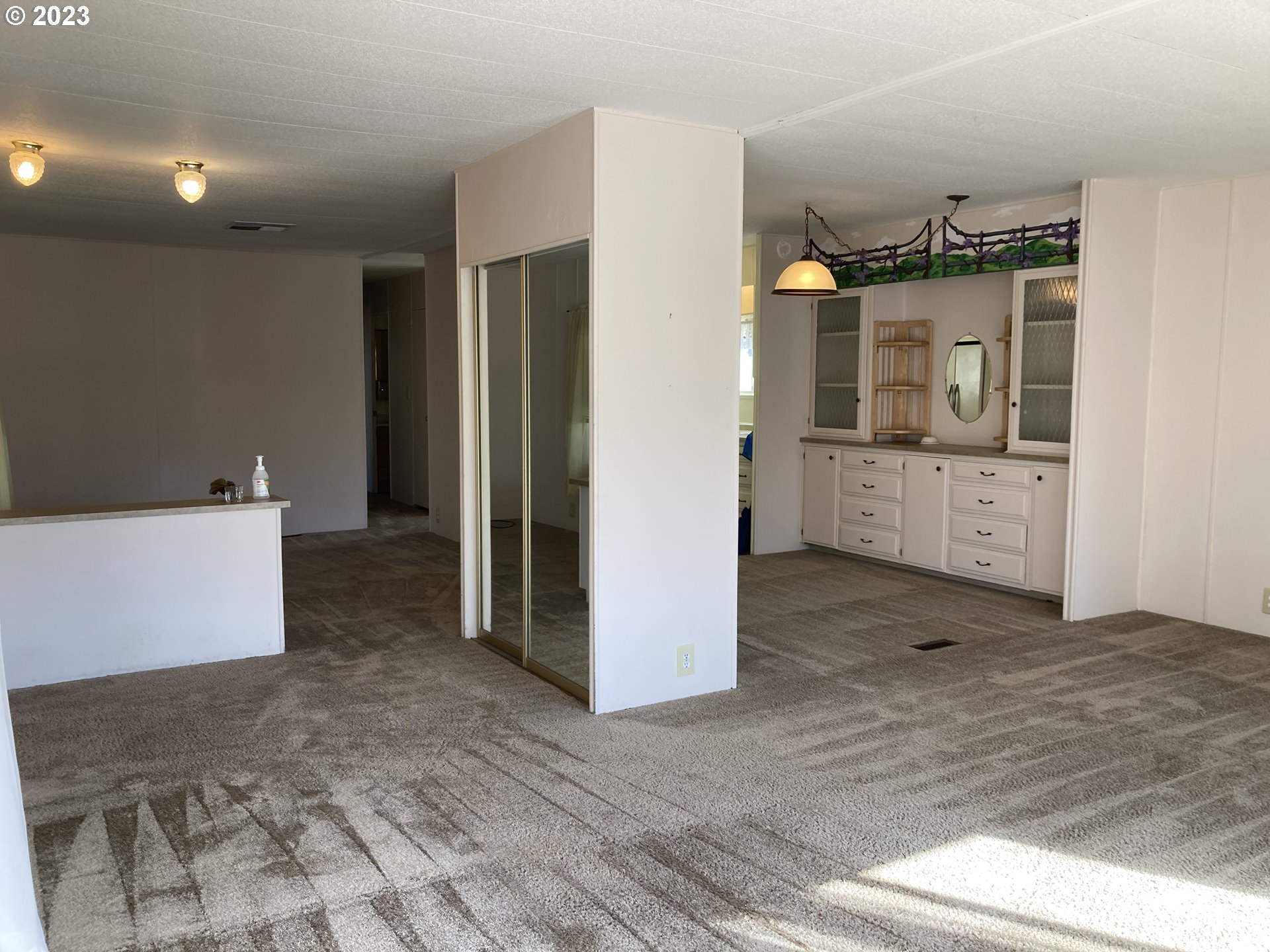 205 South 54th Street, Unit 7 Springfield, OR 97478 - Photo 10 of 32 a view of a kitchen with refrigerator and wooden floor