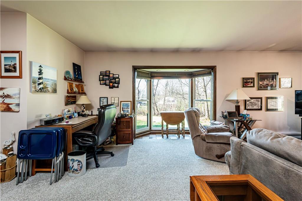 2037 Ridge Road Jeannette, PA 15644 - Photo 14 of 24 a view of a livingroom with workspace and a couch