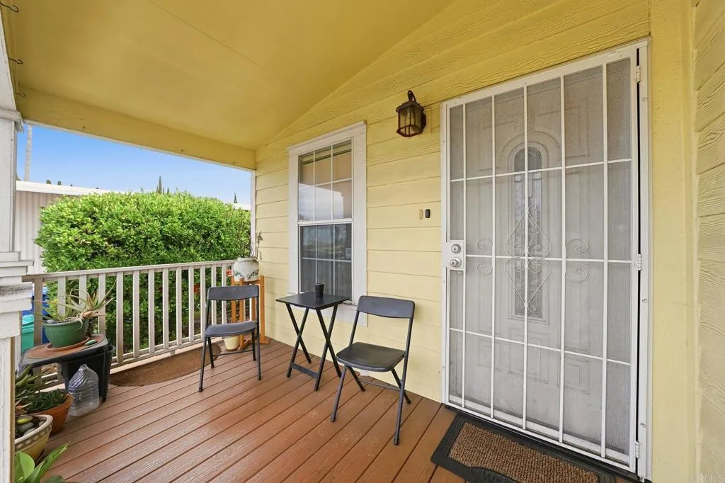 10767 Jamacha Spring Valley, Unit SPC 119 Spring Valley, CA 91978 - Photo 16 of 25 a view of a balcony with chair and wooden floor
