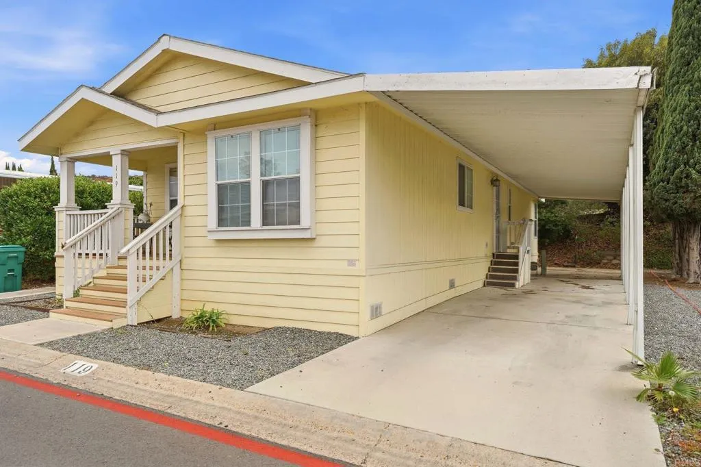 10767 Jamacha Spring Valley, Unit SPC 119 Spring Valley, CA 91978 - Photo 2 of 25 a front view of a house with a yard