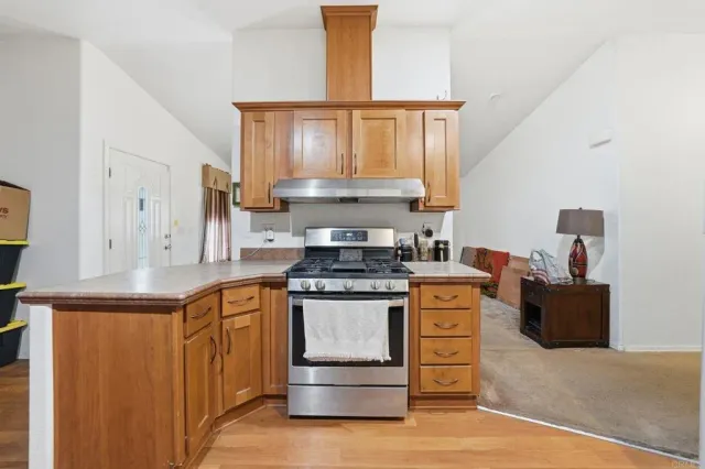 a kitchen with a stove and a sink