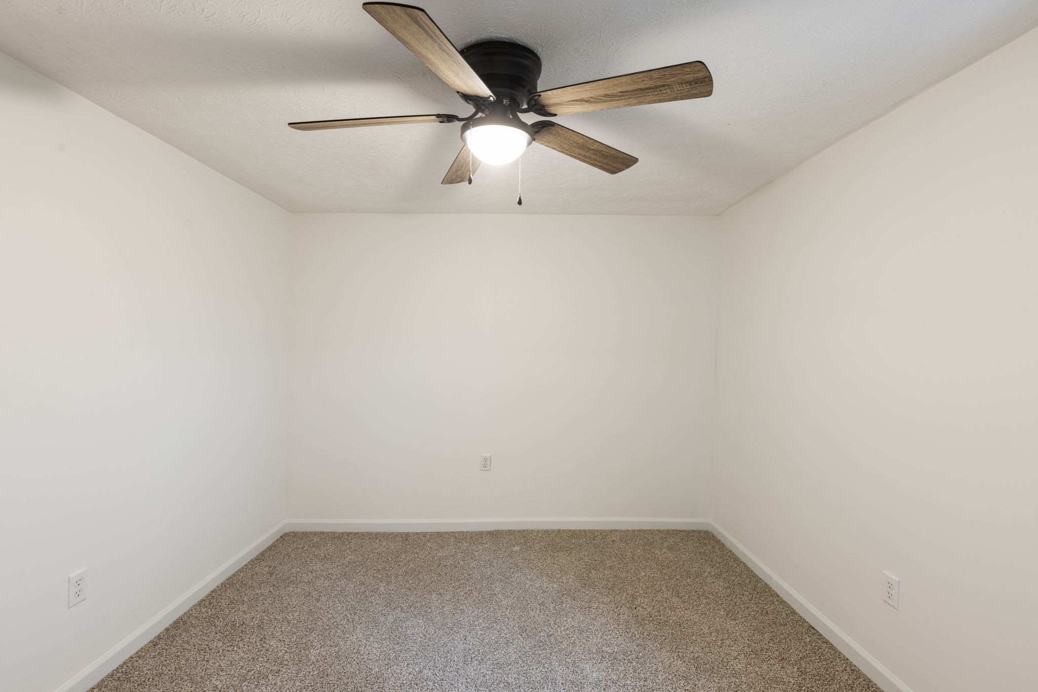 415 Durrett Street Springfield, TN 37172 - Photo 36 of 54 an empty room with a ceiling fan and carpet