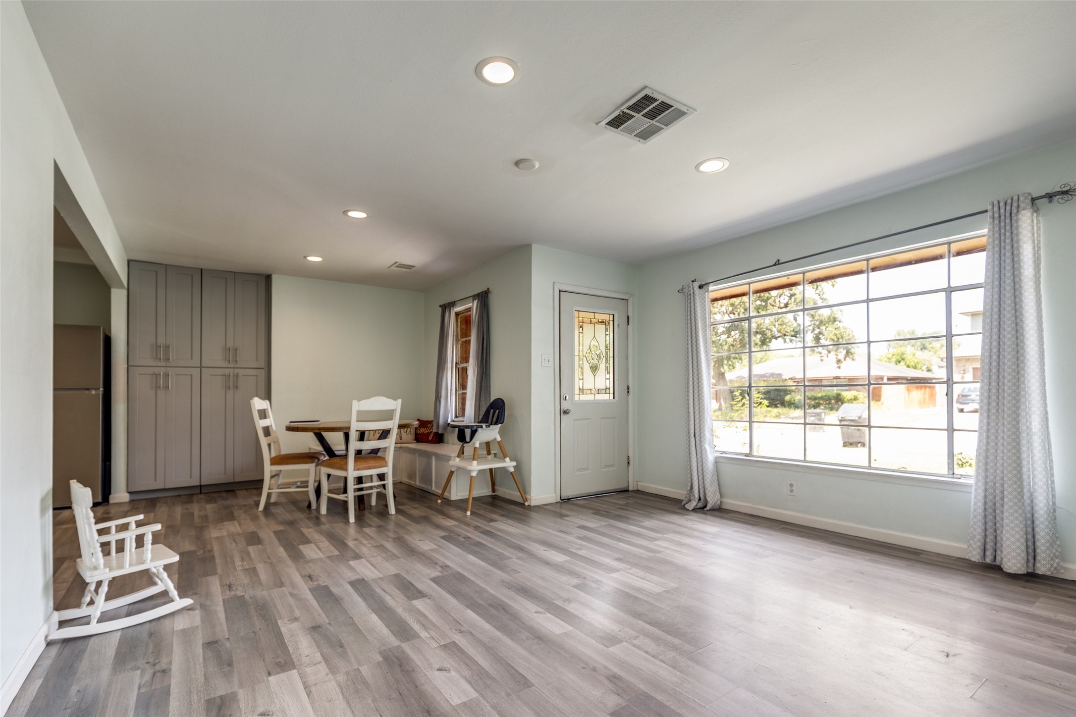 a view of a work space with furniture and windows