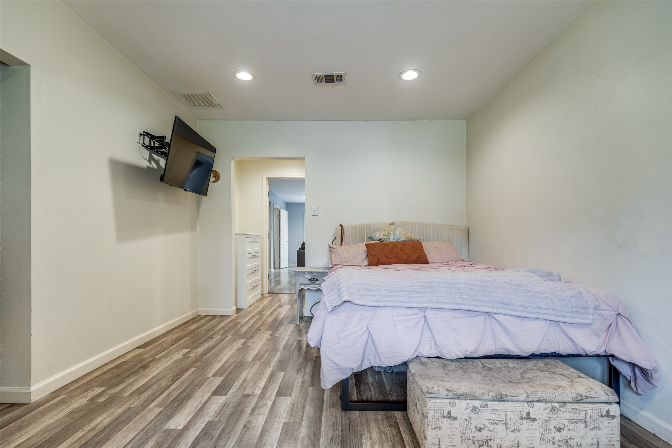 2007 Hewitt Drive Houston, TX 77018 - Photo 14 of 25 a bedroom with a bed and wooden floor