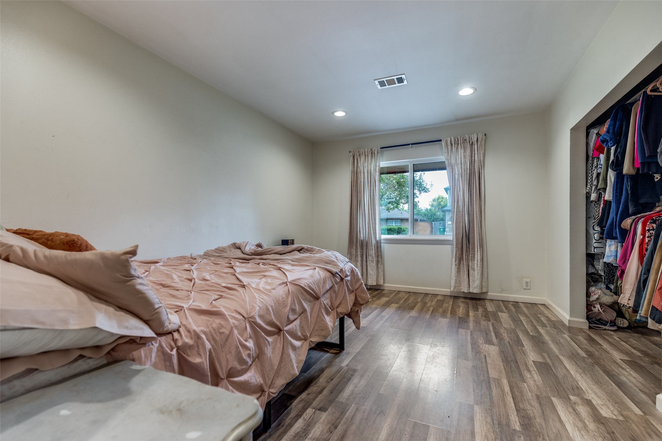 2007 Hewitt Drive Houston, TX 77018 - Photo 15 of 25 a bedroom with a bed and a wooden floor