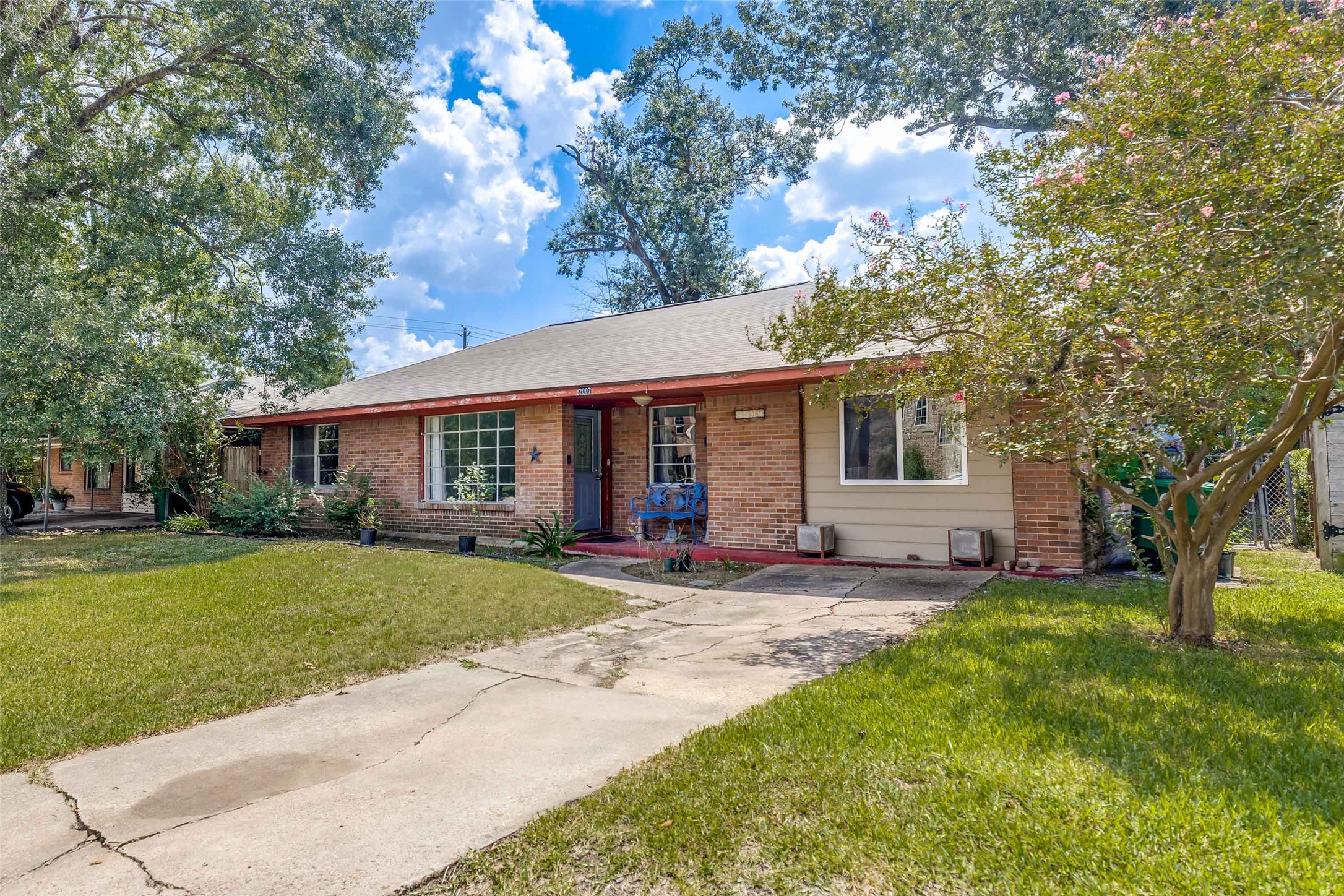 2007 Hewitt Drive Houston, TX 77018 - Photo 21 of 25 a front view of a house with a yard and trees