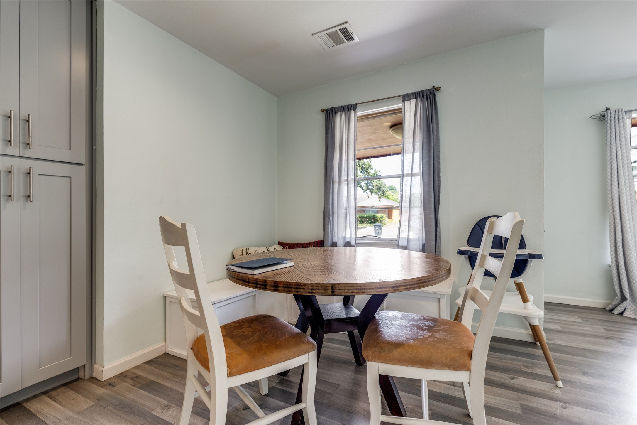 2007 Hewitt Drive Houston, TX 77018 - Photo 4 of 25 a view of a dining room with furniture and wooden floor