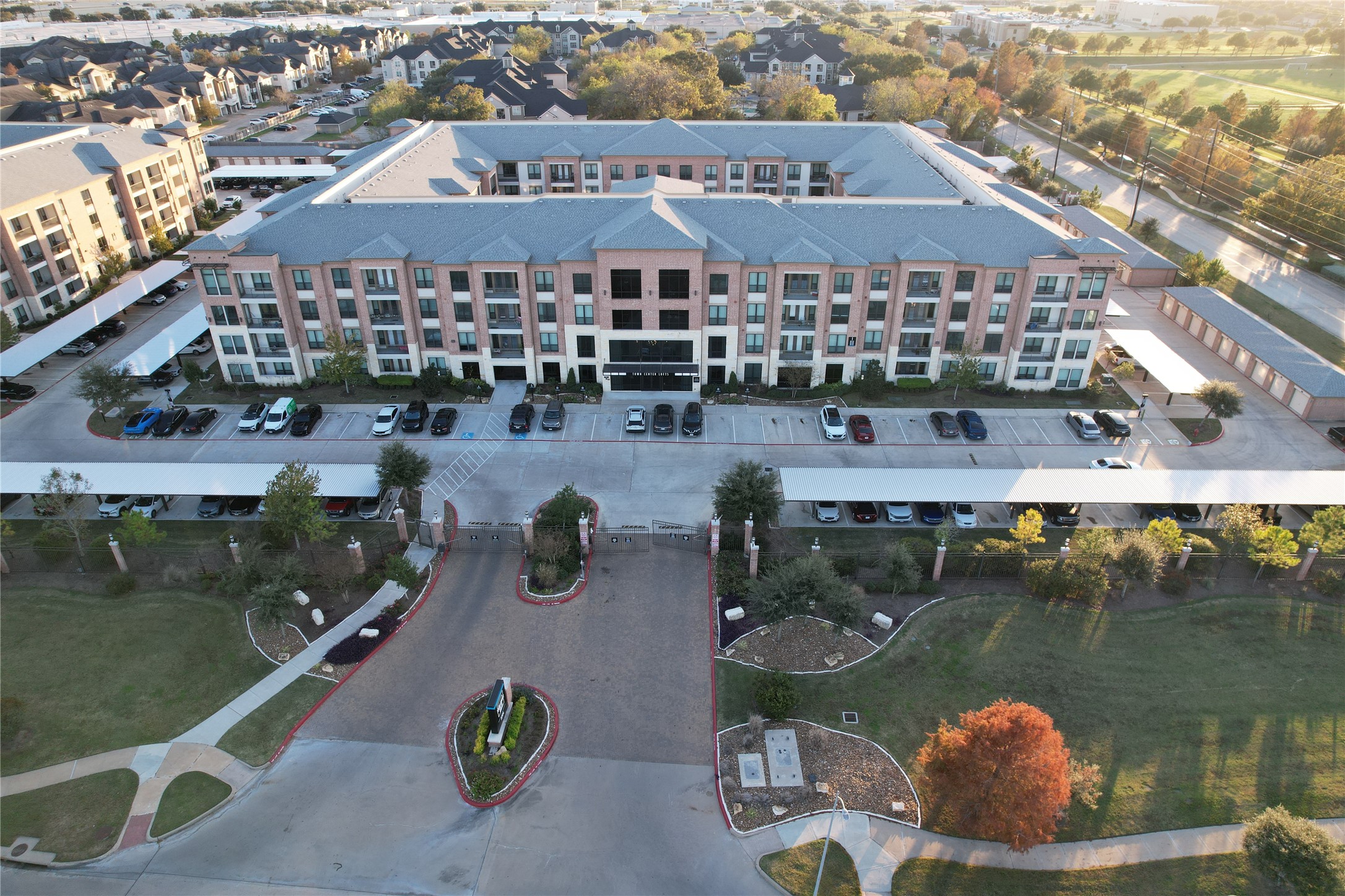 7204 Town Center Boulevard, Unit B4 Rosenberg, TX 77471 - Photo 2 of 17 an aerial view of a house with swimming pool and outdoor space