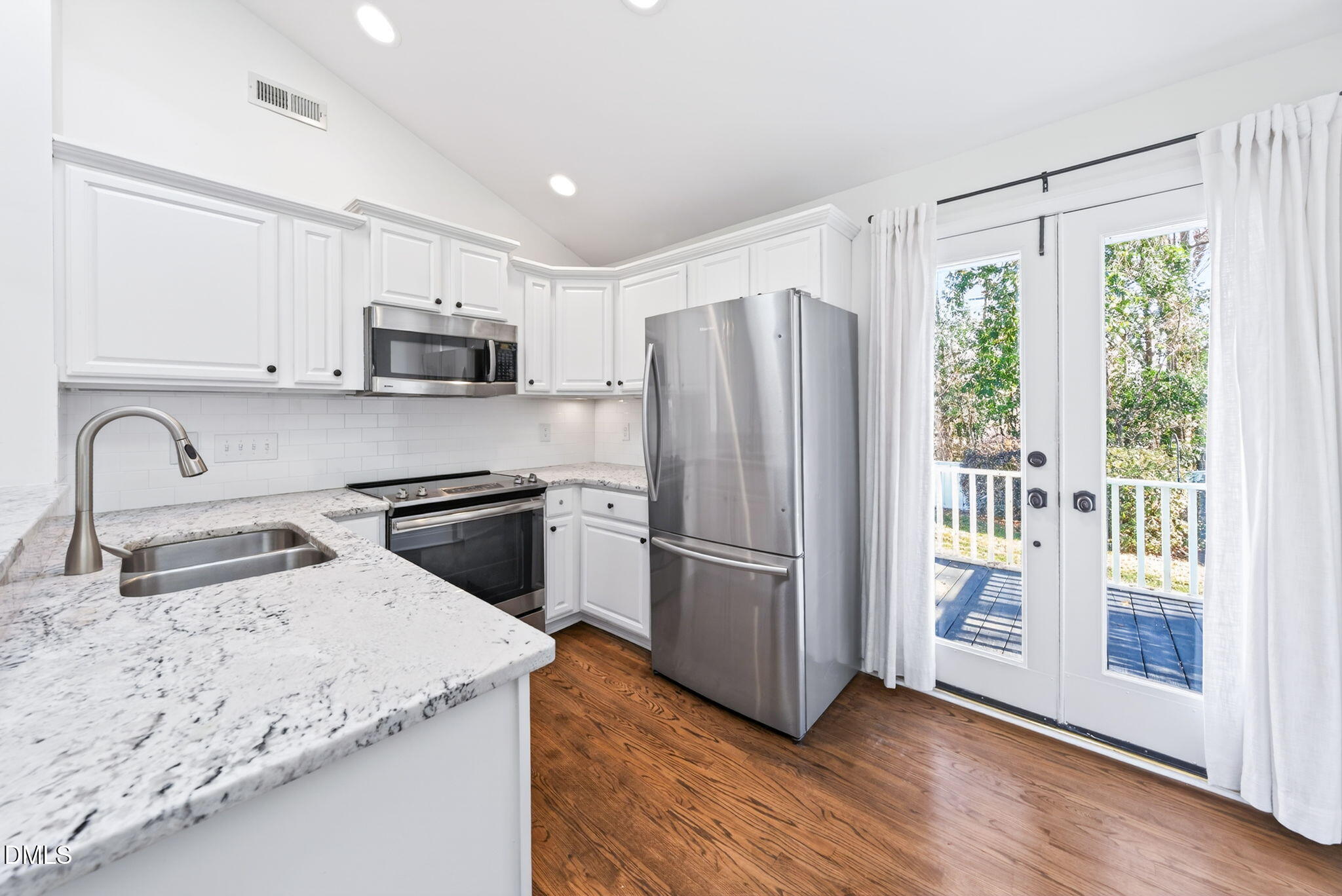 1901 Clark Avenue, Unit 105 Raleigh, NC 27605 - Photo 11 of 28 a kitchen with a refrigerator sink and microwave