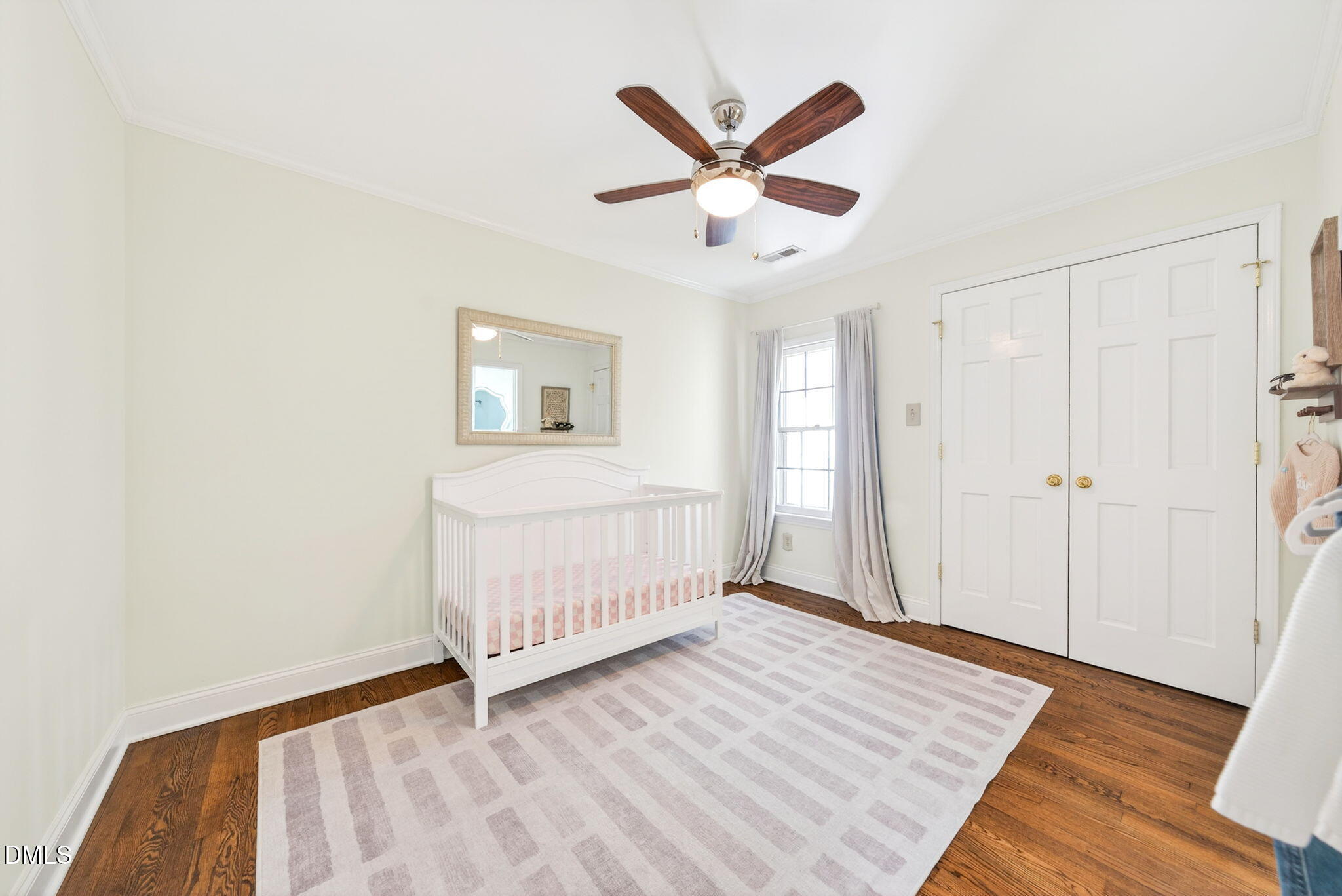 1901 Clark Avenue, Unit 105 Raleigh, NC 27605 - Photo 19 of 28 a view of a livingroom with wooden floor and white walls