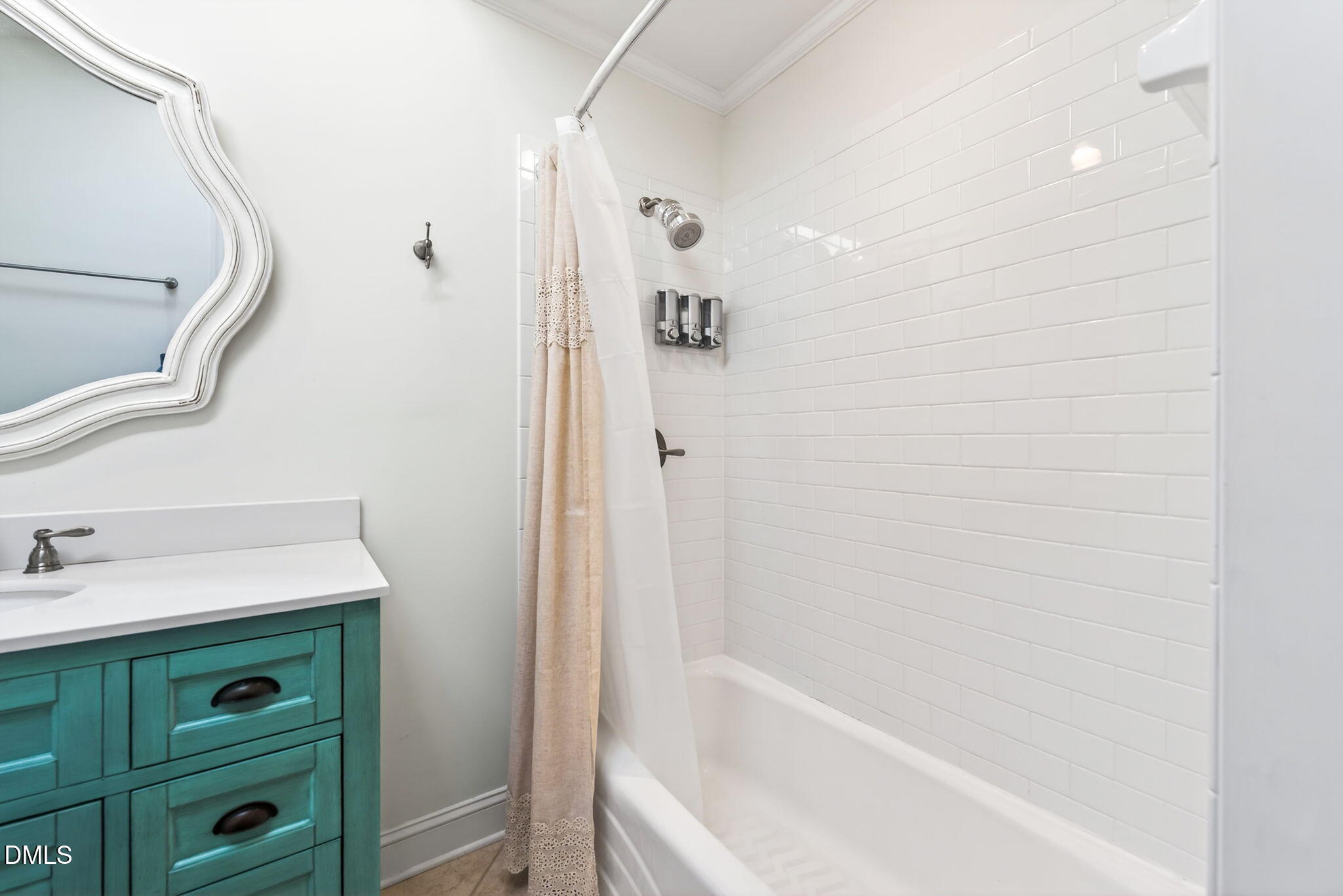 1901 Clark Avenue, Unit 105 Raleigh, NC 27605 - Photo 21 of 28 a bathroom with a bathtub a sink and a mirror