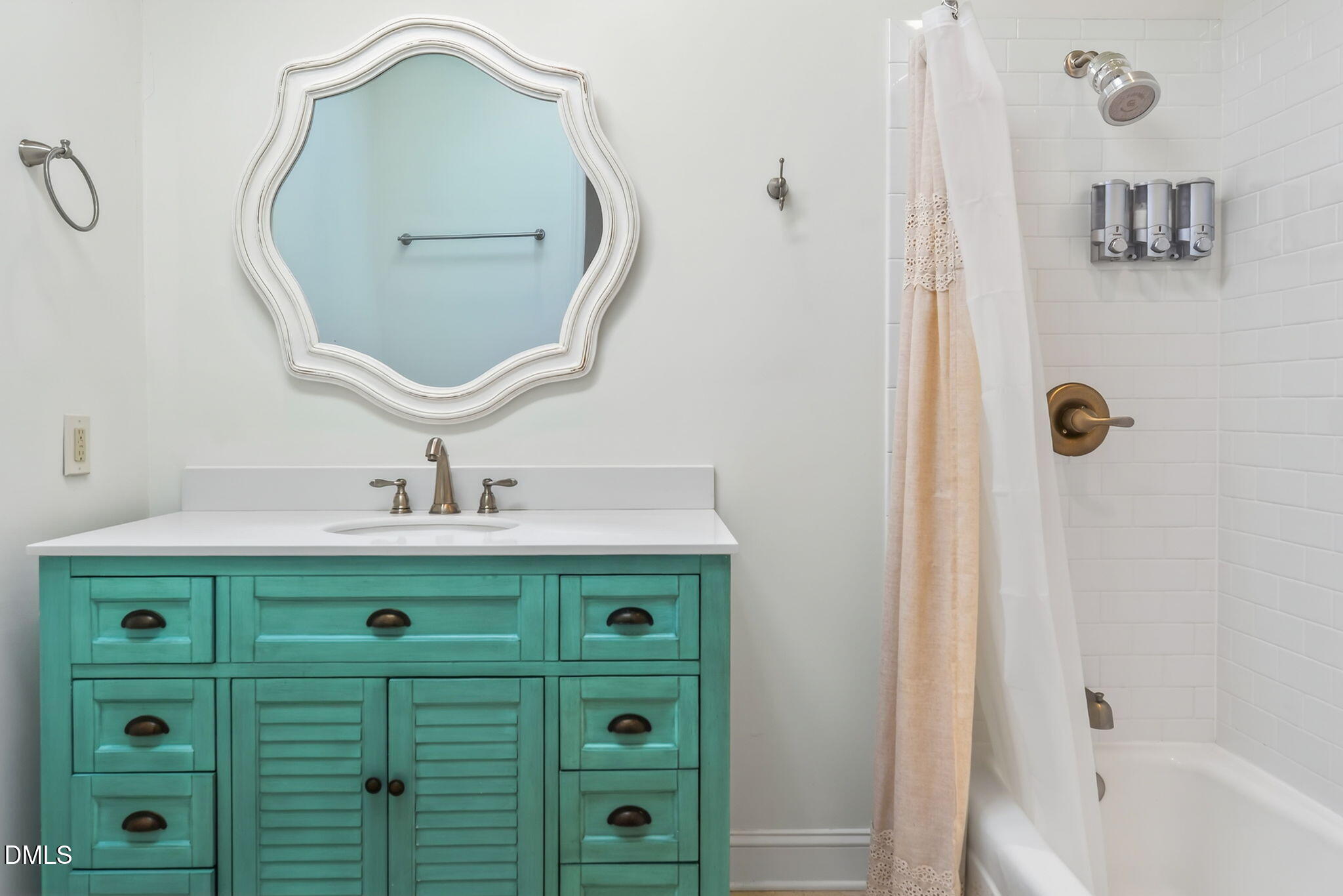 1901 Clark Avenue, Unit 105 Raleigh, NC 27605 - Photo 23 of 28 a bathroom with a sink vanity and a mirror