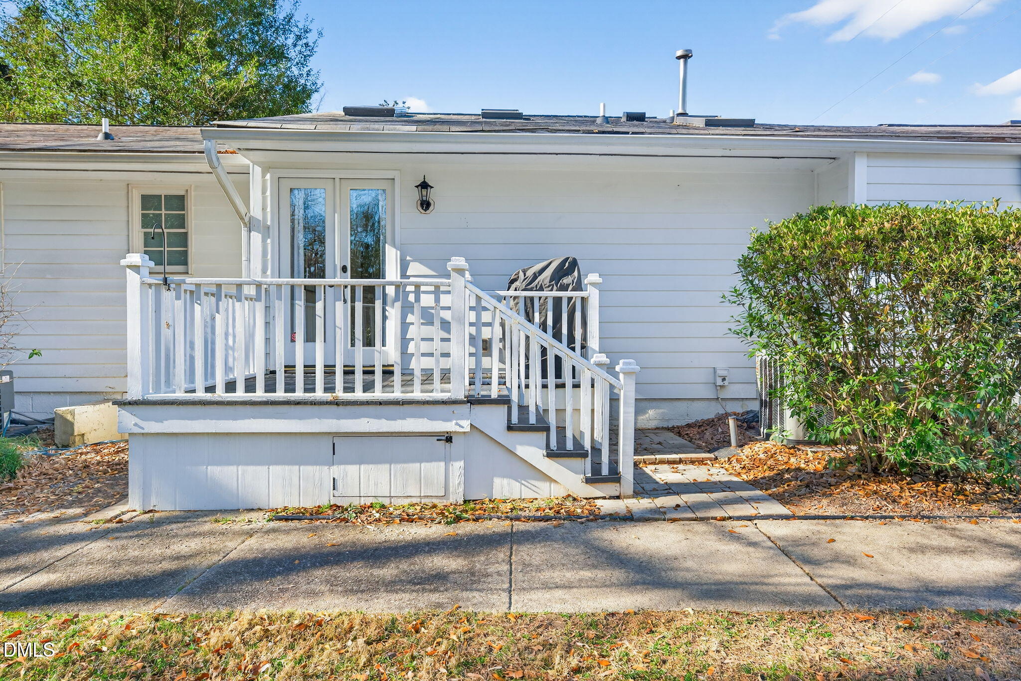 1901 Clark Avenue, Unit 105 Raleigh, NC 27605 - Photo 27 of 28 a view of a balcony with a floor to ceiling window and potted plants