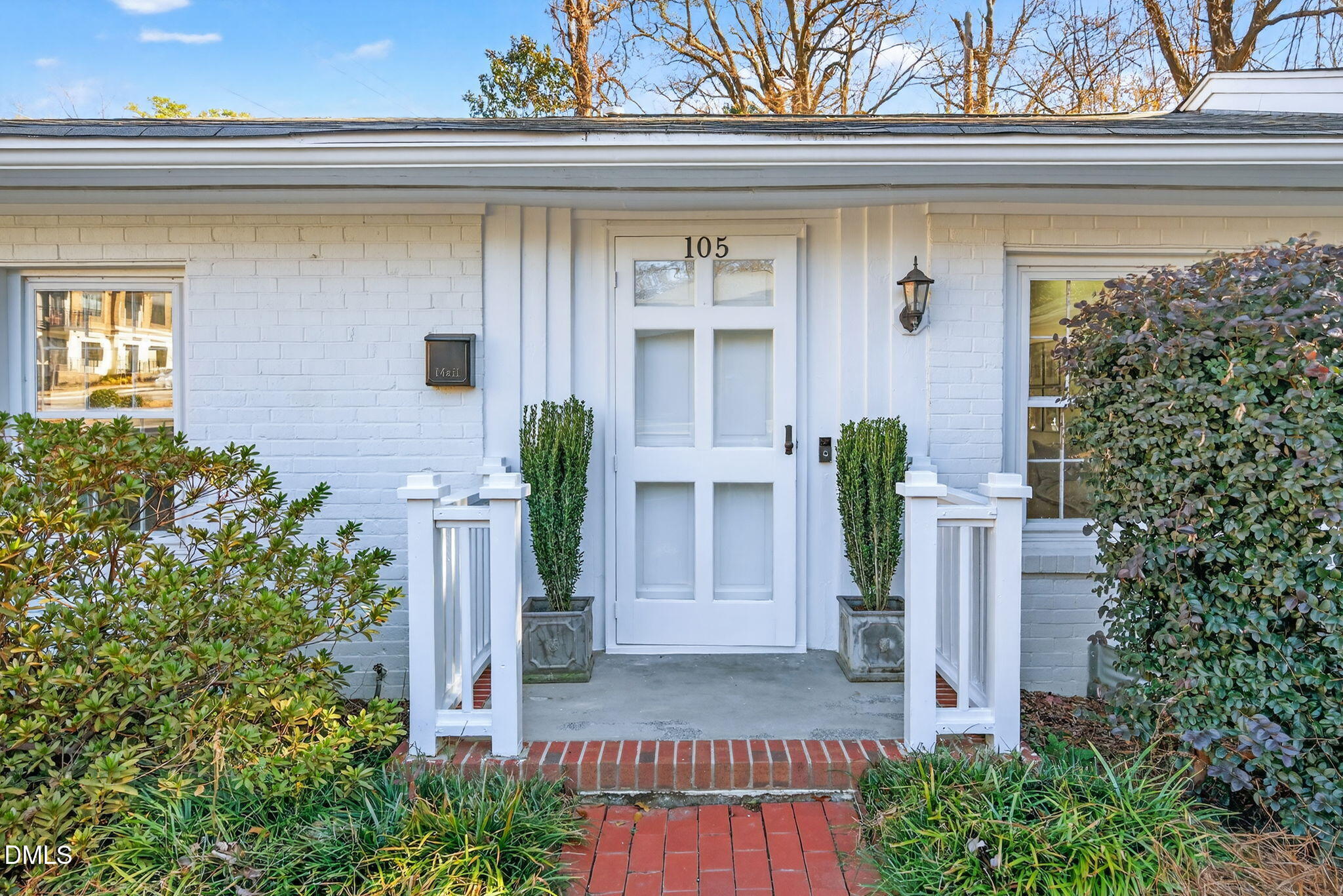 1901 Clark Avenue, Unit 105 Raleigh, NC 27605 - Photo 3 of 28 a front view of a house with plants