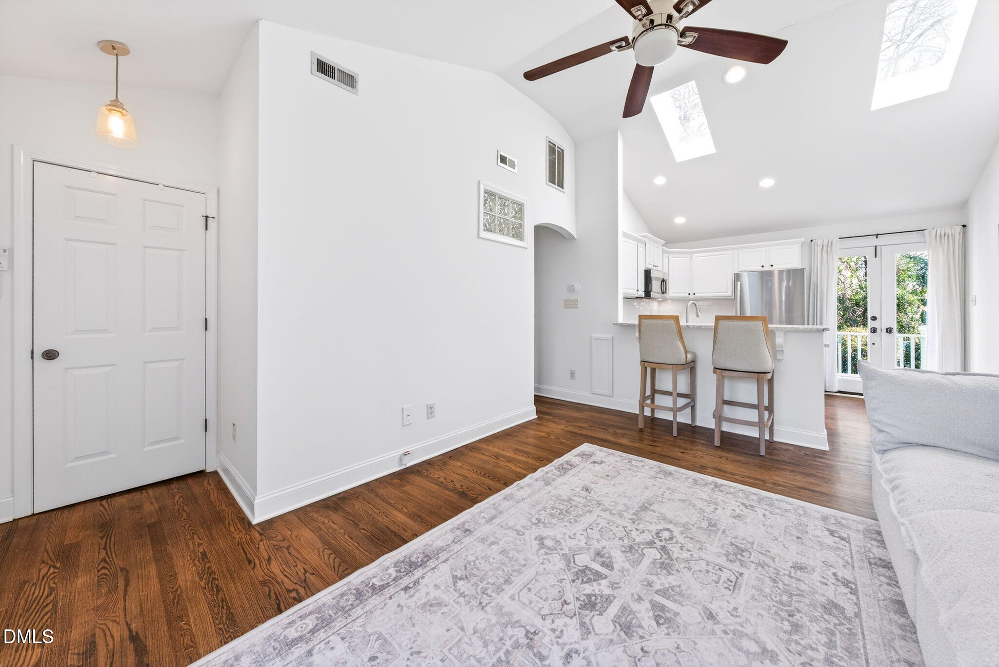 1901 Clark Avenue, Unit 105 Raleigh, NC 27605 - Photo 6 of 28 a view of a livingroom with furniture and a ceiling fan