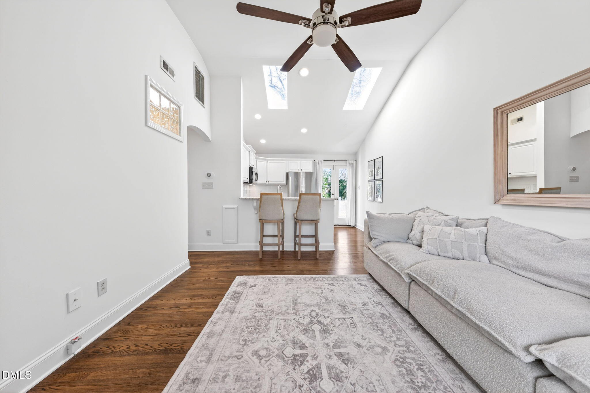 1901 Clark Avenue, Unit 105 Raleigh, NC 27605 - Photo 7 of 28 a living room with furniture and a chandelier