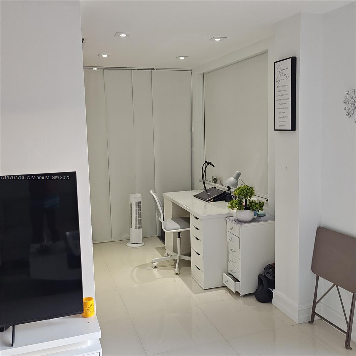 2750 Northeast 183rd Street, Unit 301 Aventura, FL 33160 - Photo 14 of 38 a view of a room with table and chair