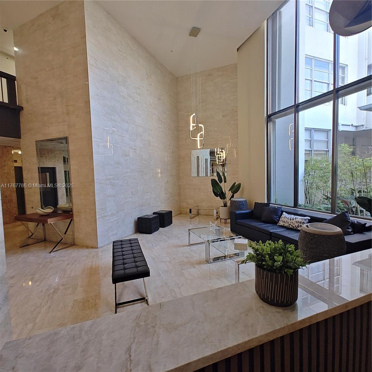 2750 Northeast 183rd Street, Unit 301 Aventura, FL 33160 - Photo 23 of 38 a living room with furniture