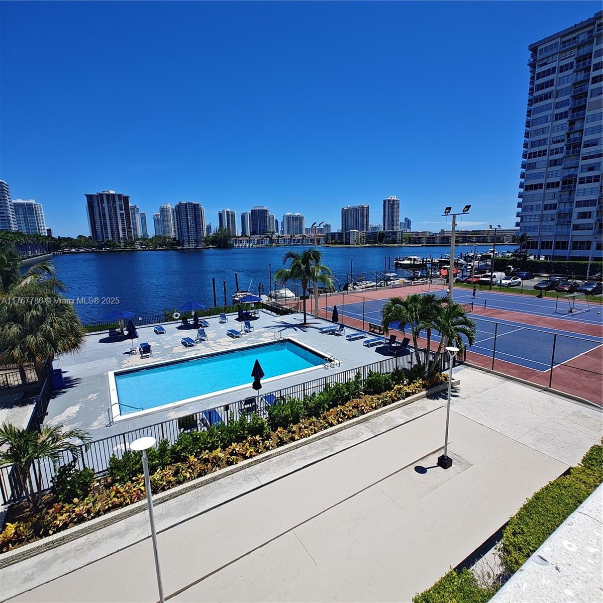 2750 Northeast 183rd Street, Unit 301 Aventura, FL 33160 - Photo 26 of 38 a view of a terrace with chairs and potted plants