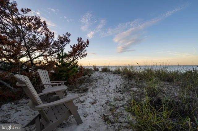 a view of staircase with furniture and rug