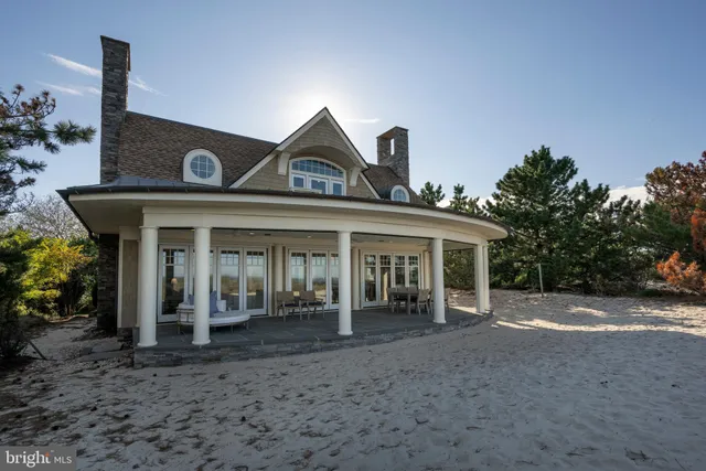 a view of a living room and a floor to ceiling window