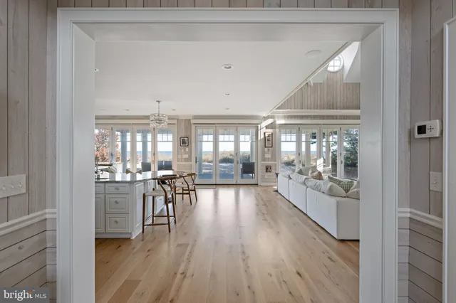 a bathroom with a granite countertop double vanity sink and a mirror