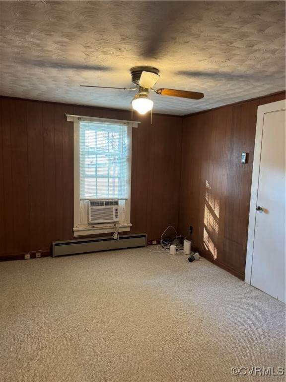 14807 Spruce Avenue Chester, VA 23836 - Photo 8 of 20 Carpeted empty room with wood walls, ceiling fan,