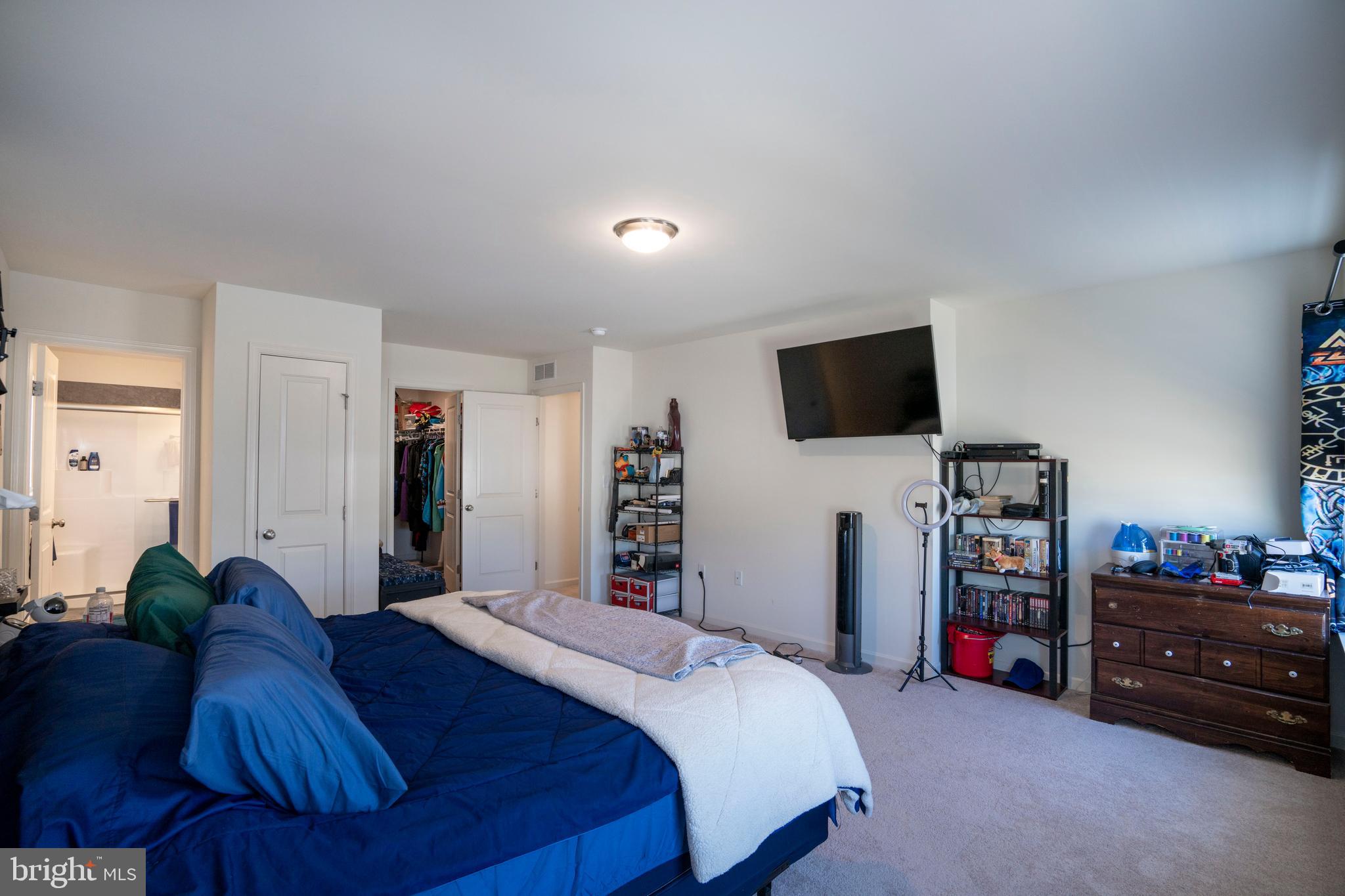 273 Fawn Valley Road State College, PA 16803 - Photo 24 of 47 a bedroom with a bed and a flat tv screen on a dresser
